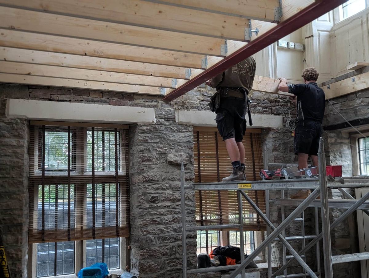 Timber roof structure and steel beam framing during an extension in Skipton